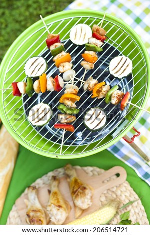 Bar-B-Q or BBQ with kebab cooking. coal grill of chicken meat and peppers. barbecuing dinner