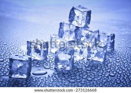ice cubes pyramid over dark background