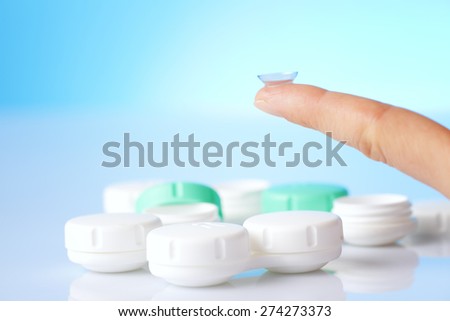 contact lens on finger  and cases
