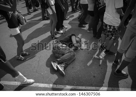 SAMARA,RUSSIA-JUNE 2: drunken teenager sleeping at  the street, june 2,2012,Samara, Russia