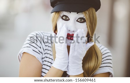 portrait of  mime with black hat and white gloves