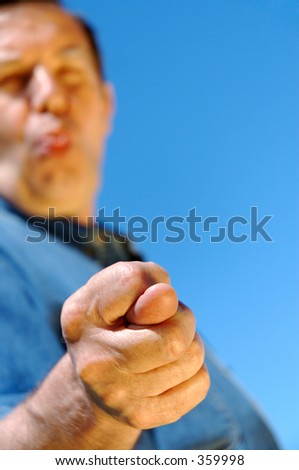 middle-aged unseriousily man showing fig with one's tongue hanging out