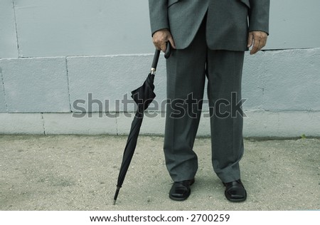 businessman with umbrella (special photo f/x,focus point on the hands)