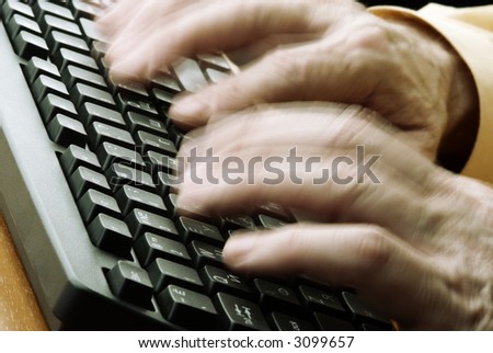 work on computer (special photo toned and motion blur f/x, focus on keyboard(selective))