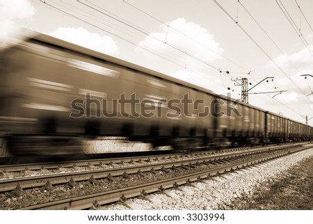 freight train (special toned and blur-motion photo f/x, focus point on railroad embankment and rail)