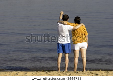 man and woman on the beach (special photo f/x, focus point on people)