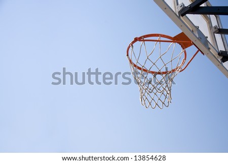 basket on blue sky background, selective focus on nearest part