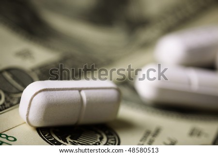 Cost of Healthcare  (selective focus on nearest pill)