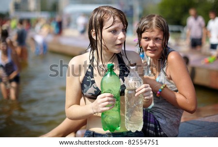 SAMARA,RUSSIA-JULY 24: young people shooting and throwing water at each other during Water Wars flash-mob , July 24, 2011, Samara, Russia