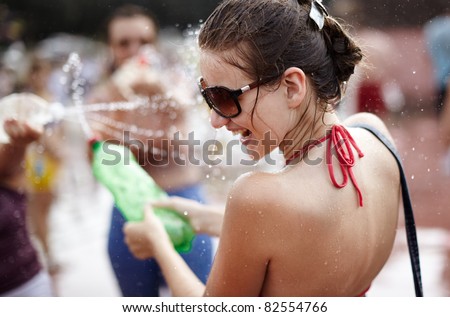 SAMARA,RUSSIA-JULY 24: young people shooting and throwing water at each other during Water Wars flash-mob,July 24, 2011, Samara, Russia