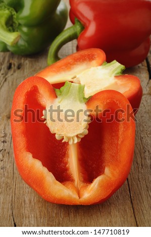 Cross section red bell pepper on wooden background