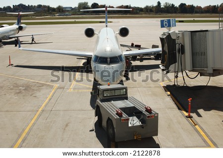commercial jet plane being serviced before take-off