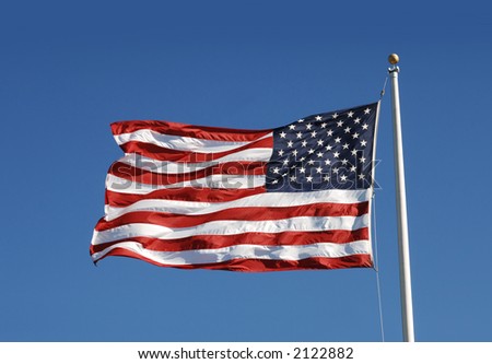 waging US flag against blue sky