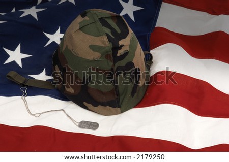 US Army helmet and dog tag on US flag background
