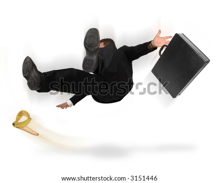 stock photo : Businessman slipping and falling from a banana peel on a white 