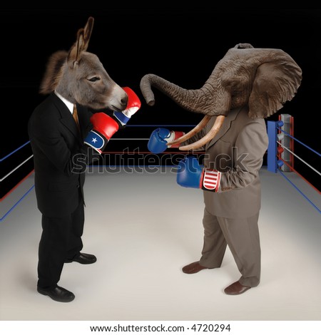 US Republican and Democrat mascots represented by a donkey and an elephant face off in a boxing ring in business suits with red white and blue boxing gloves.