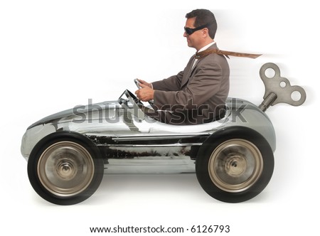 stock-photo-mn-in-a-wind-up-pedal-car-on-white-background-6126793.jpg