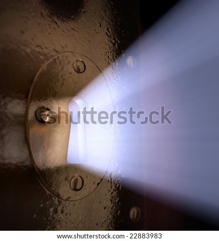 A close-up of light pouring out of a key hole.
