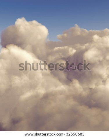Cumulus clouds shot from a high altitude against a blue sky