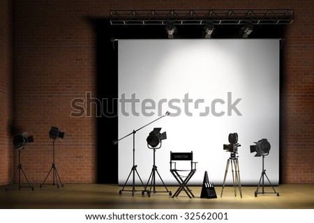 Movie set inside a sound stage with movie lights, movie camera, boom mic, director\'s chair, megaphone and clapper board