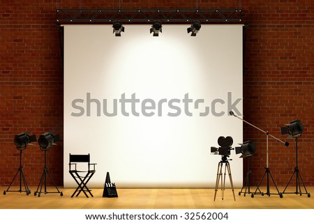 Movie set inside a sound stage with movie lights, movie camera, boom mic, director\'s chair, megaphone and clapper board