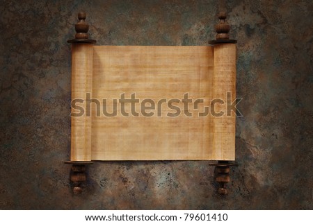 Ancient parchment scrolls with blank papyrus opened on a stone background with clipping path