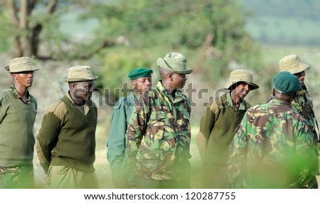 MAASAI MARA, KENYA - NOVEMBER 9: Group of Rangers men on November 9, 2012 in Maasai Mara, Kenya. Park rangers protect wildlife by enforcing park rules.
