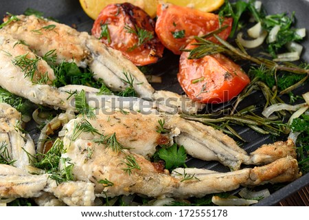 Frogs Legs Fried with Garlic and Herbs and Lemon