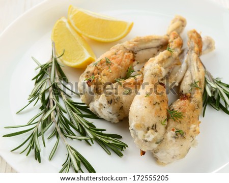 Frogs Legs Fried with Garlic and Herbs and Lemon