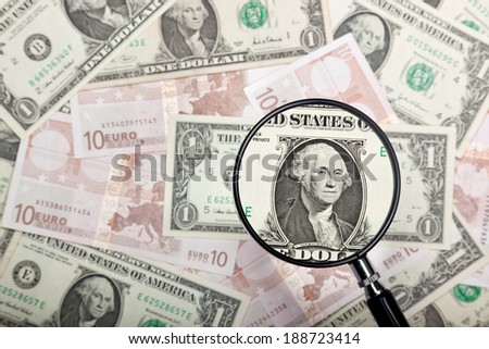 Focusing on US dollar note against US and Euro currencies background