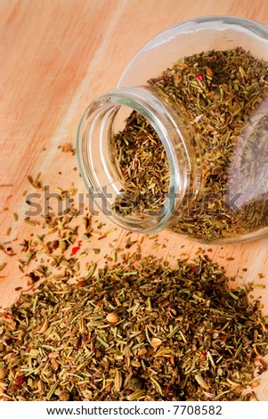 Jar of mixed herbs on a table