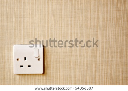 British Standard BS 1363 AC power socket at the corner of a wall