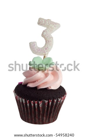 Mini cupcake with birthday candle for three year old isolated on white background