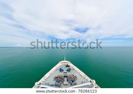 Cruise ship in open sea showing the bow, sea and sky