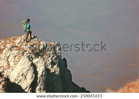 Woman hiking in beautiful mountain, recreation and healthy lifestyle outdoors in nature. Hiker backpacker looking at view.