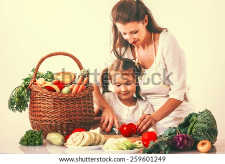 Mom and child preparing vegetables