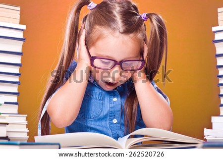 Little scholar girl with pile of books yelling
