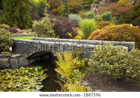 Arranged flowers along a bridge in Vancouver Queen Elizabeth Park. More with keyword group14h