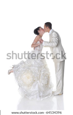 stock photo Isolated on white kissing bride in wedding dress and groom