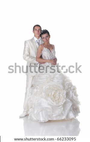 stock photo Isolated on white groom in lightcolored suit and bride in 