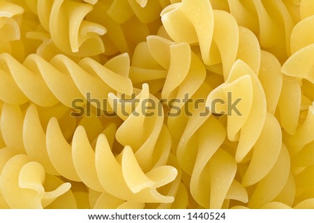 Close up and abstract details of a bowl of pasta twirl shapes