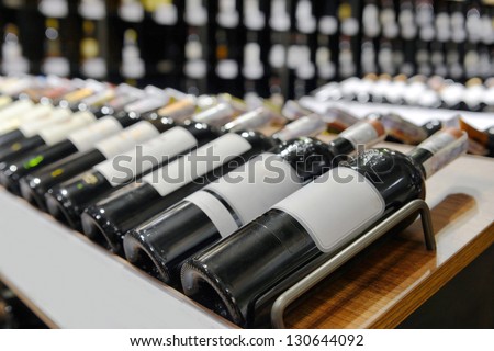 Red And White Wine In Bottles In Wine Shop