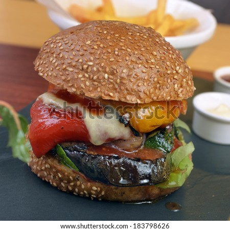 veggie burger with vegetables, fries sauce