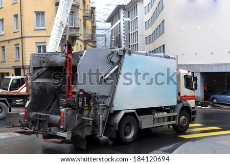 garbage truck in the street cities