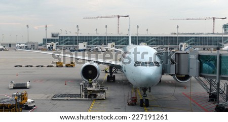 MUNICH, GERMANY, SEPTEMBRE 2014: Lufthansa airbus airplane parked on Munich airport while people are boarding to the flight  SEPTEMBRE 2014 in MUNICH, GERMANY