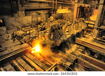 heated steel pigs on the rolling mill