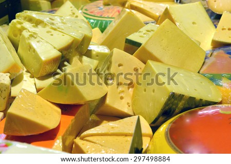 cheese on display in a supermarket