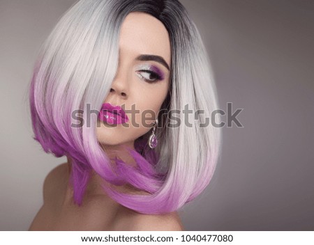 Ombre bob blonde short hairstyle. Purple makeup. Beautiful hair coloring woman. Fashion Trendy haircut. Blond model with short shiny hairstyle. Concept Coloring Hair. Beauty Salon.