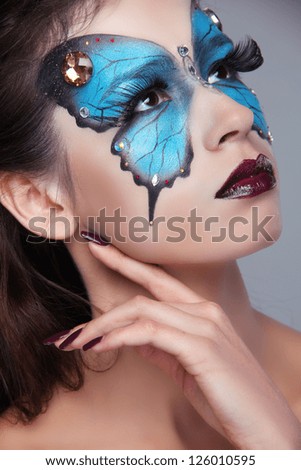 Fashion Make up. Butterfly makeup on face beautiful woman. Art Portrait.