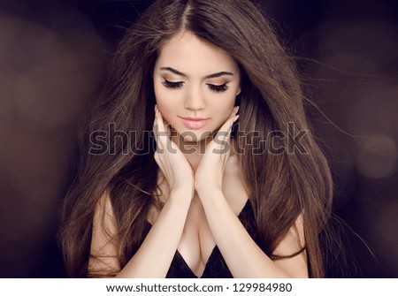 Beautiful woman with long brown hair. Fashion long hairstyles